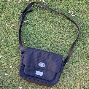 Small black Baggallini bag with metal clasp